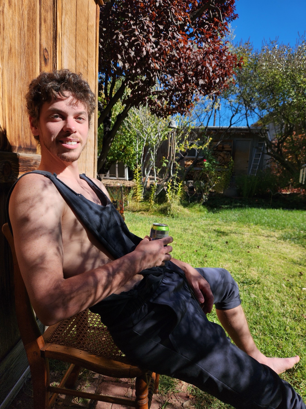 Mar sitting in a chair in a sunny garden